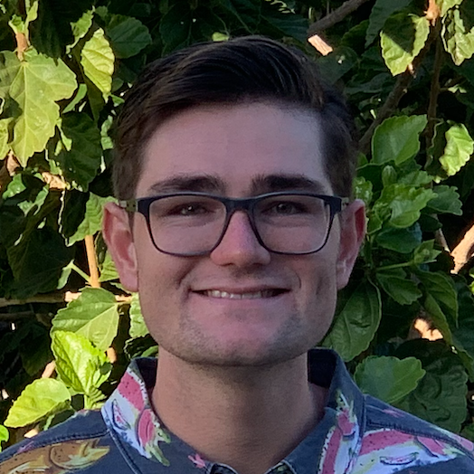 A picture of me in front of a hibiscus tree.